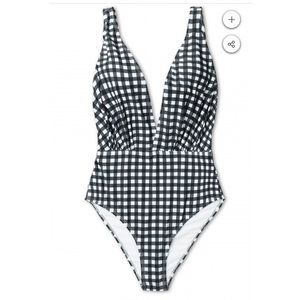 Black and white plunging one piece swimsuit